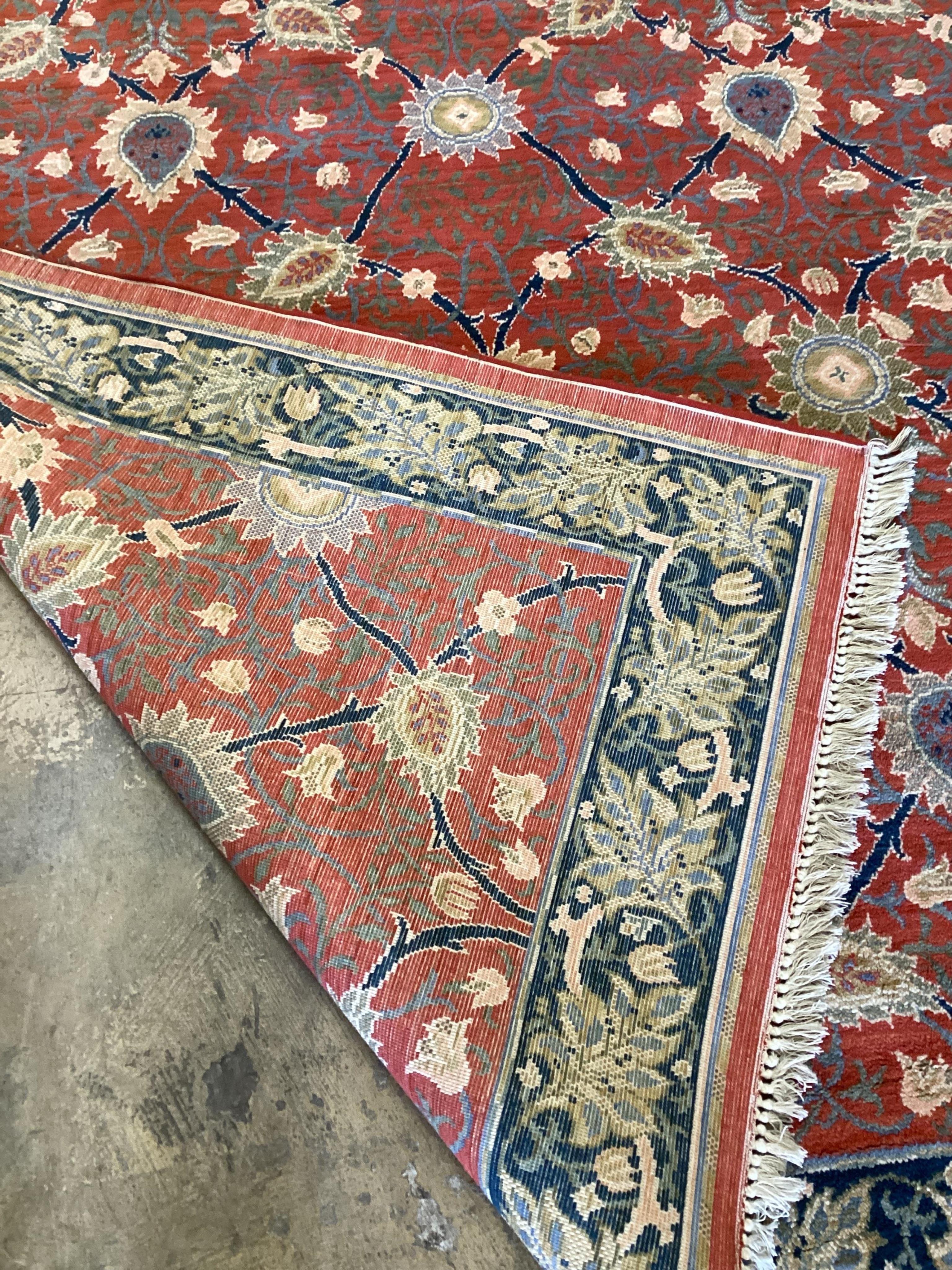 A North West Persian style brick red ground floral carpet, 288cm x 198cm. Condition - good